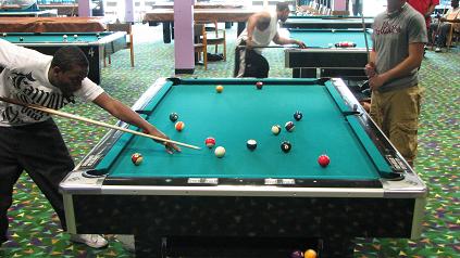 University Commons Arcade Students playing pool.