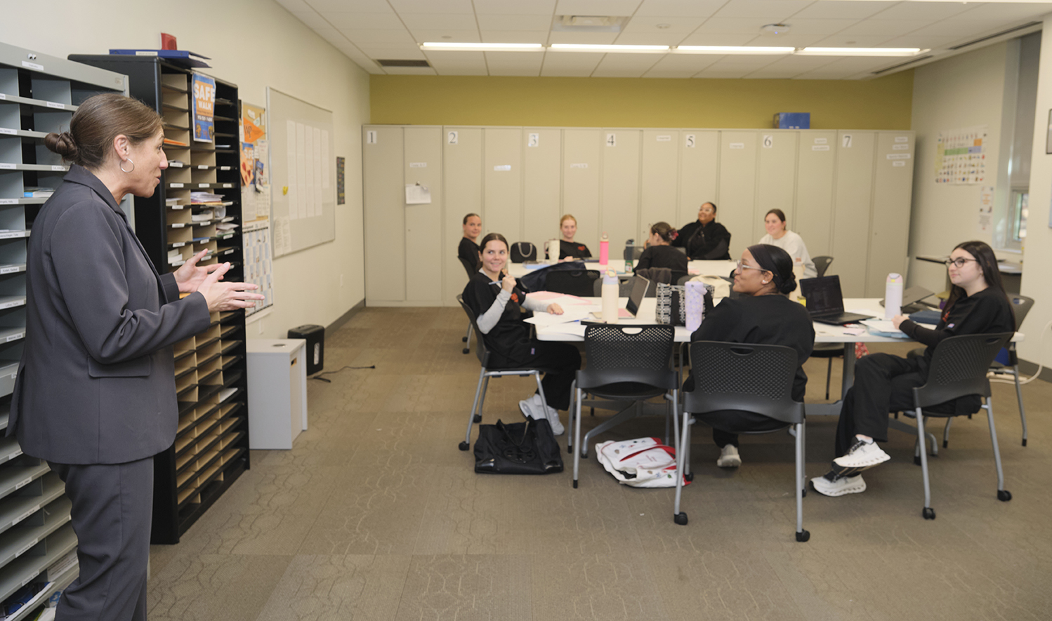 Secretary Chaly visiting graduate students in the speech-language pathology program
