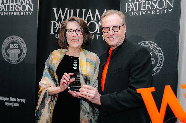 Professor Carol Frierson-Campbell accepts her Legacy Award from President Helldobler.