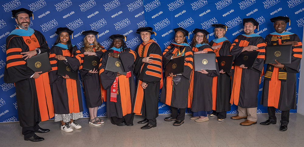 President Helldobler with graduates who earned a doctorate in educational leadership.