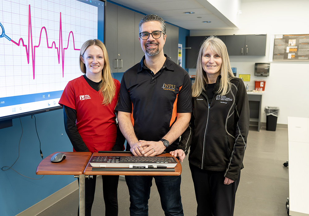 Professor Michael Figueroa with alumni clinicians Bethann Kiely and Christine Dorenbush