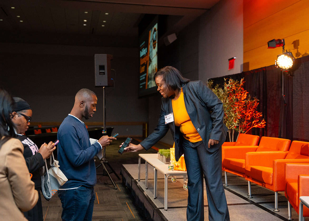 Students line up to exchange contact information with Tasha Forrester after the panel.