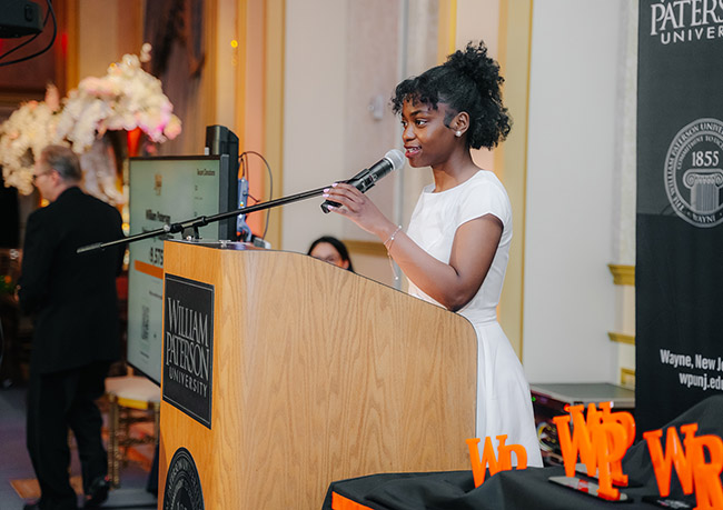 Legacy Scholar Wood-Janny Nashtaby Fifi addresses the crowd.