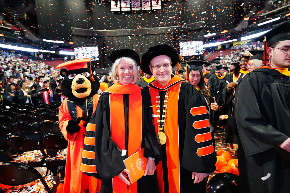 University President Richard J. Helldobler celebrates the graduates alongside President Emerita Kathleen Waldron.