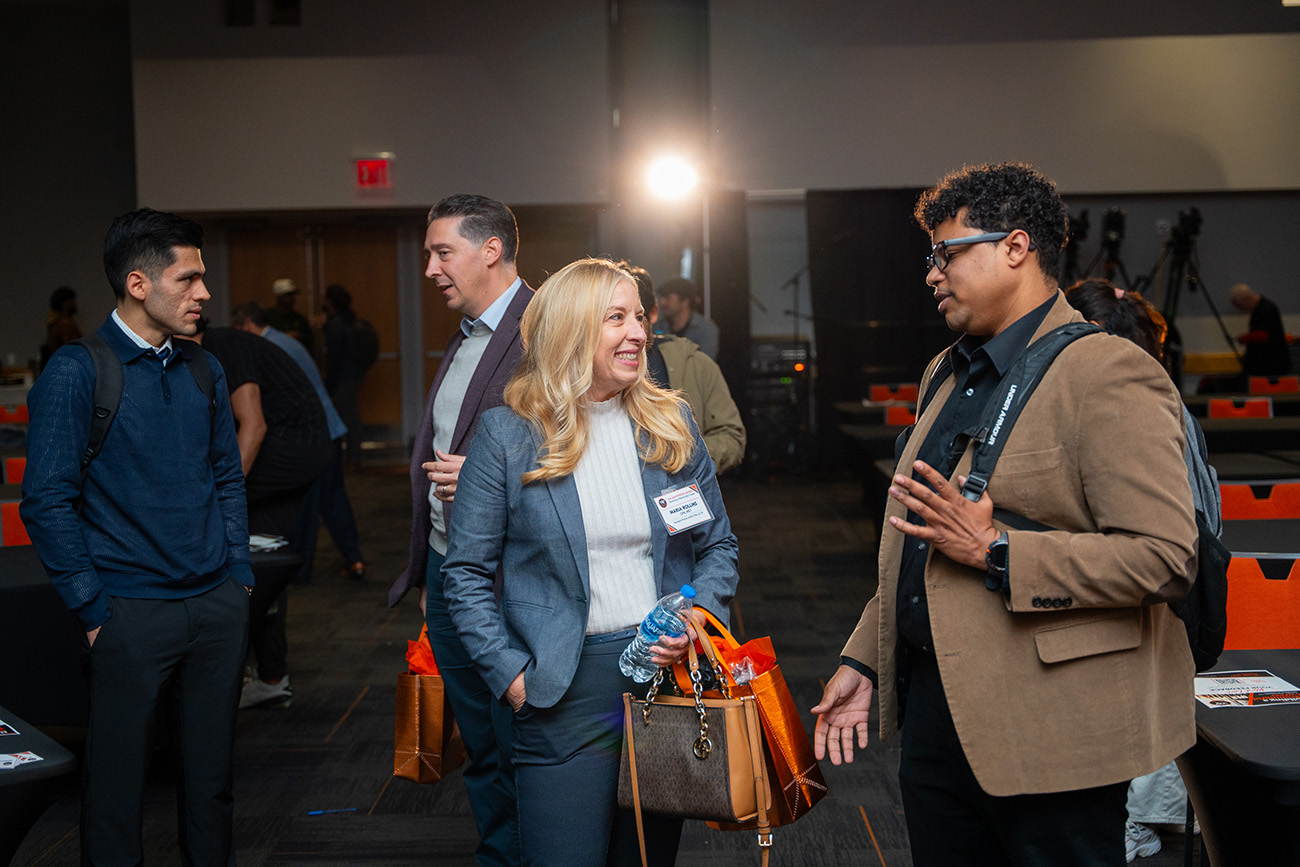 Maria Rollins and Justin Black meet with students after the panel.