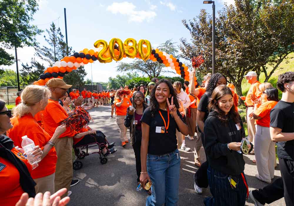 A William Paterson University student entering through the Welcome Day gauntlet