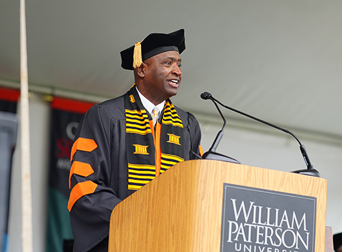 Marc Medley addresses the crowd during the evening commencement ceremony.