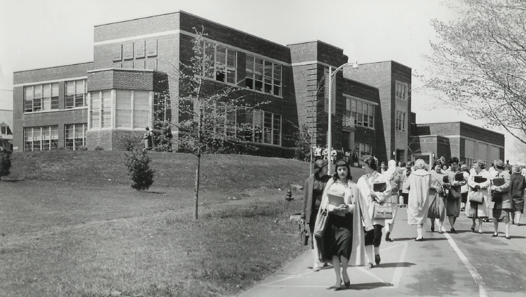 Students walking past Hunziker Hall in the 1950s
