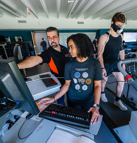 Students and professor in kinesiology lab